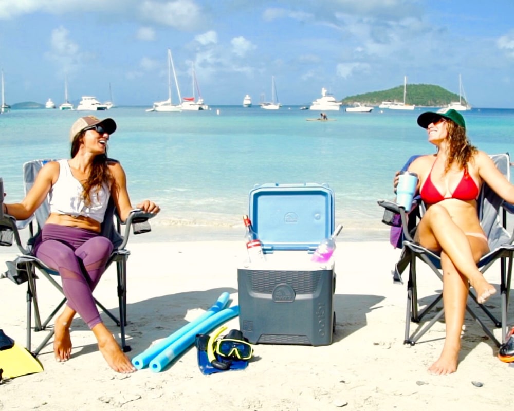 two girls tanning on beach during private Virgin Islands jeep tour