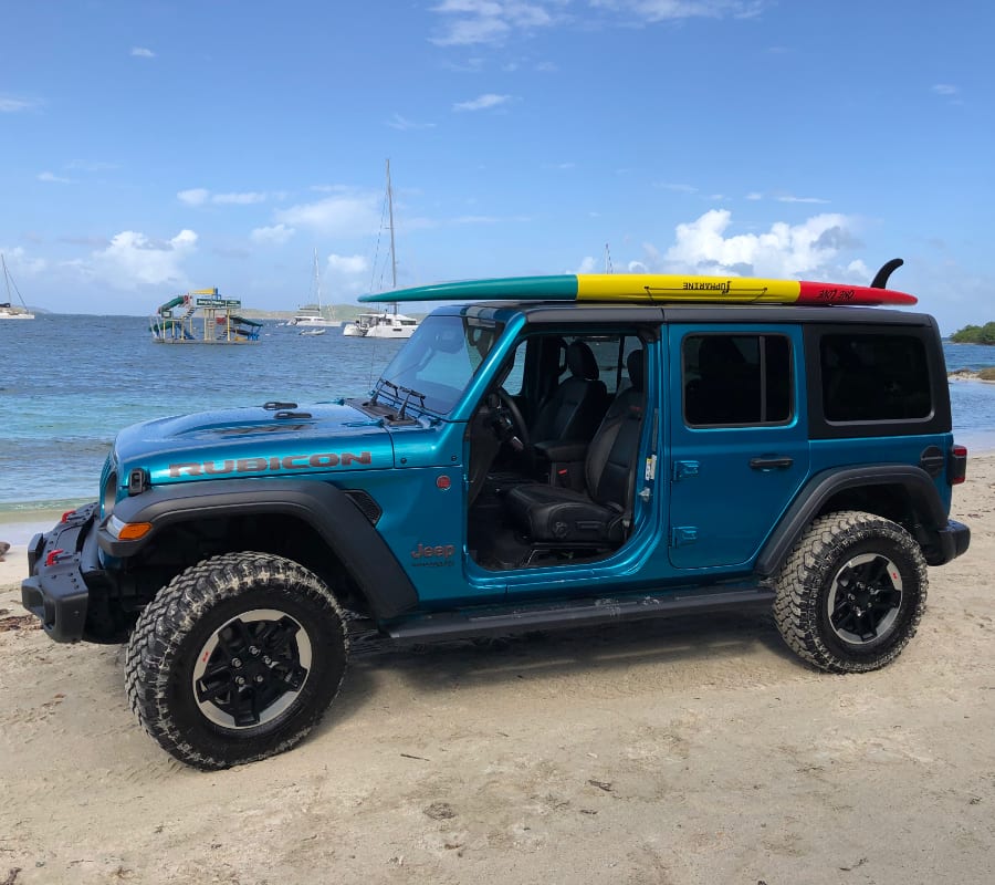Jeep with SUP paddleboard on roof